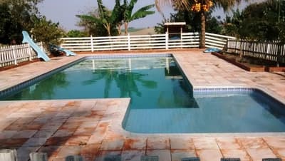 Foto 1 de 6: Area Rural em leilão em Atalaia - PR — Lote de Terras, com área de 14.166,00 m², contendo duas residência em alvenaria, quiosque, piscina e estabulo, Nova Esperança/PR